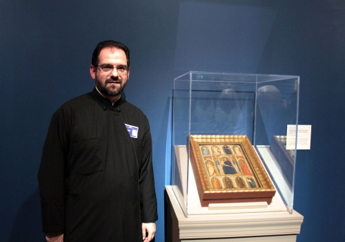 Rev. Dr. Stefanos Alexopoulos with “Madonna and Child with Annunciation and Female Saints” by Puccio Capanna